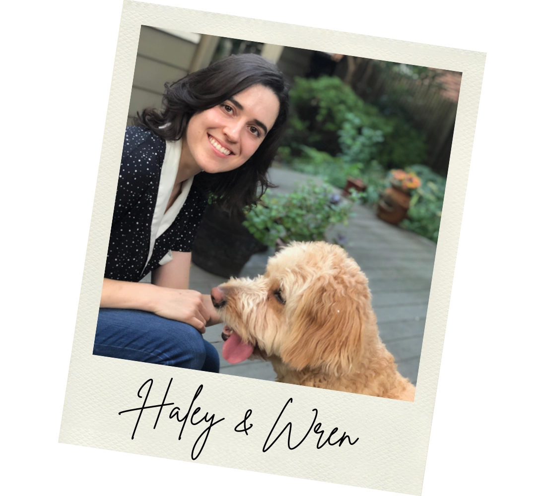 Haley Russell sitting with a golden dog named Wren