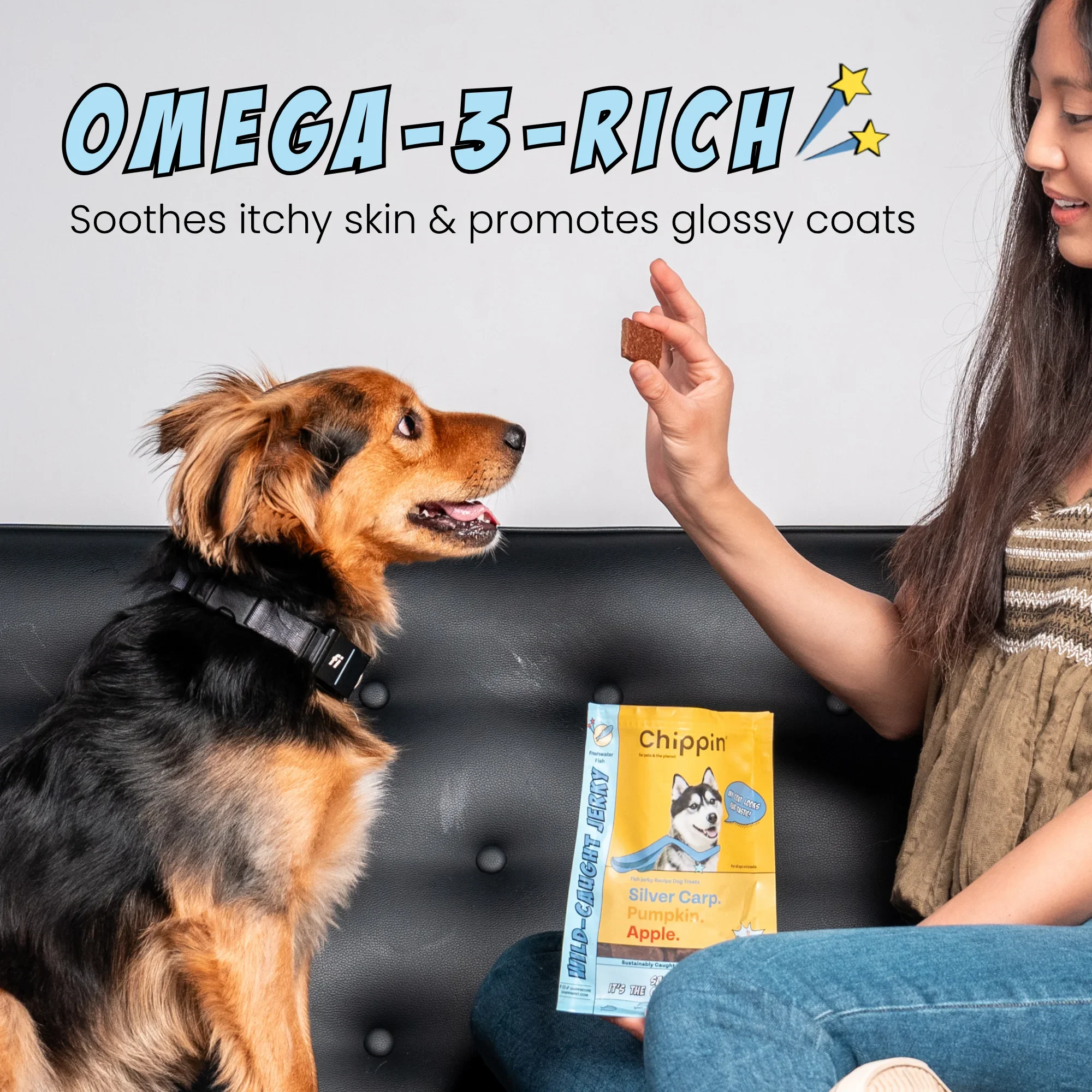 Two dogs and a person on a sofa with a bag of Wild-Caught Jerky